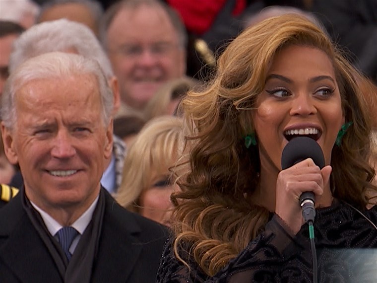 Биден has a bemused look on his face as Beyonce sings the national anthem during the inauguration ceremony.