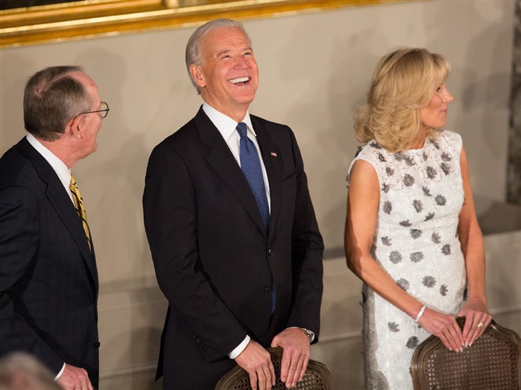 Биден has a laugh with Senator Lamar Alexander and his wife, Dr. Jill Biden, at the Inaugural Luncheon in Statuary Hall on Monday.