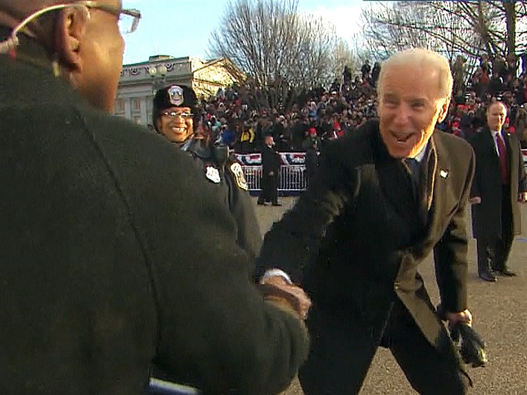 Вице President Joe Biden shakes hands with Al Roker during the inauguration parade.