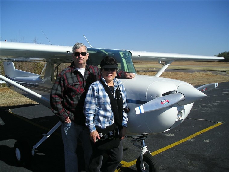 Боб and Setsuko Harmon next to one of the Cessna plans Setsuko used to fly.