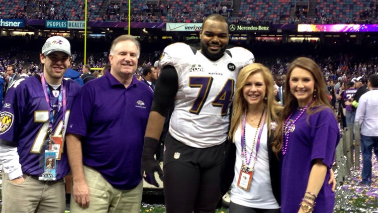 De Tuohy family celebrate together on the field after Michael's 2013 Super Bowl win with the Baltimore Ravens.