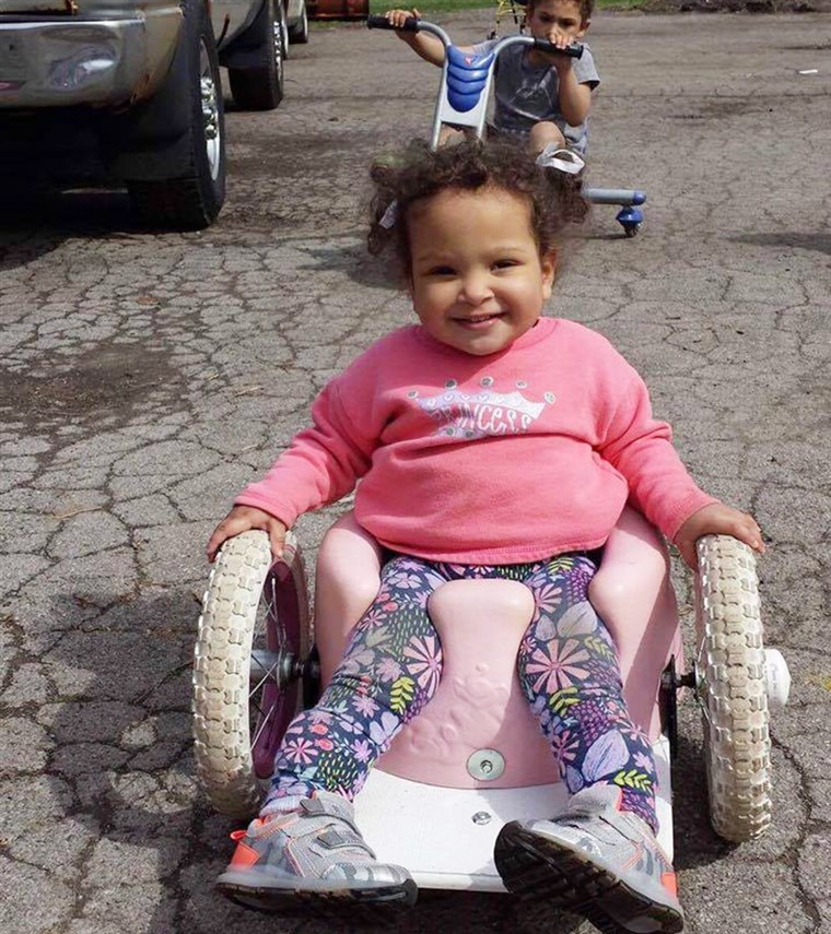 Tack to a Bumbo-seat wheelchair, Bella Shorr can chase her brother and sister around outside.