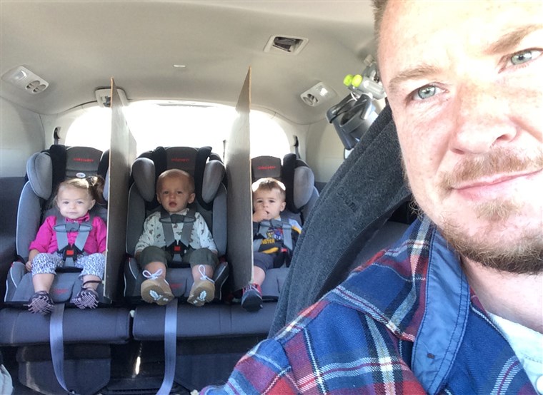 Гад goes viral after creating divider walls between his triplets' car seats to keep them from fighting.