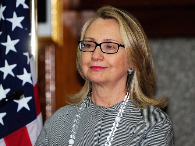 Она looks a bit relieved, no? A makeup-less Hillary Clinton looks on during a press conference in Dhaka on March 5.