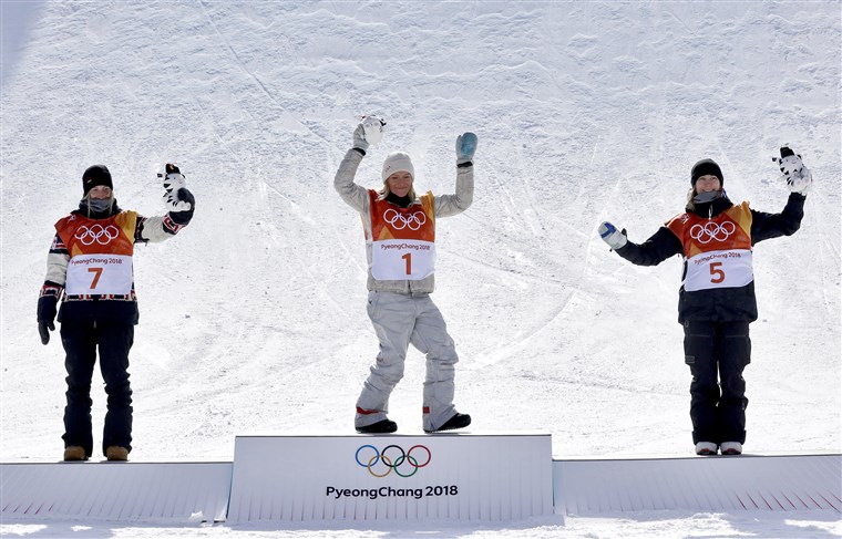 Од left: silver medal winner Laurie Blouin, of Canada, gold medal winner Jamie Anderson, of the United States, and bronze medal winner Enni Rukajarvi, of Finland, celebrate after the women's slopestyle final.