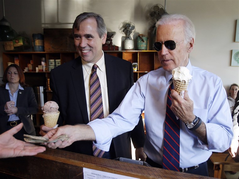 Вице President Joe Biden, right, pays for ice cream cones for himself and U.S. Sen. Jeff Merkley after a campaign rally in Portland, Ore., Wednesday, ...