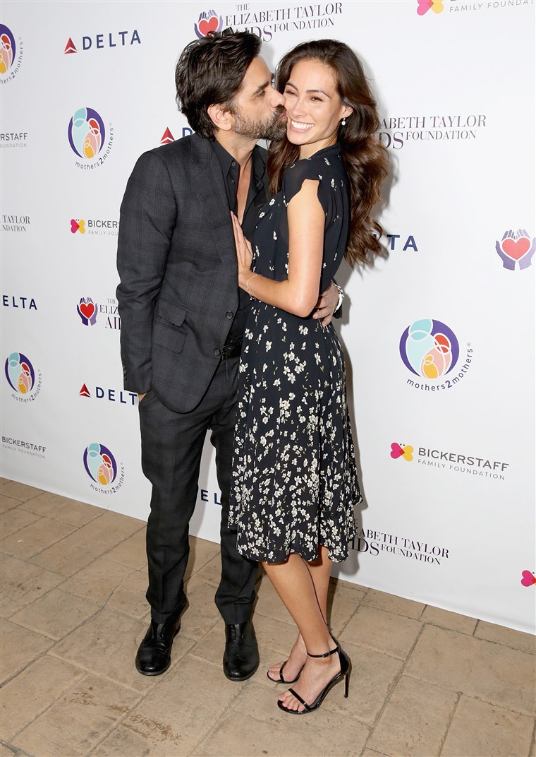 Ioan Stamos and Caitlin McHugh attend The Elizabeth Taylor AIDS Foundation and mothers2mothers dinner in October.