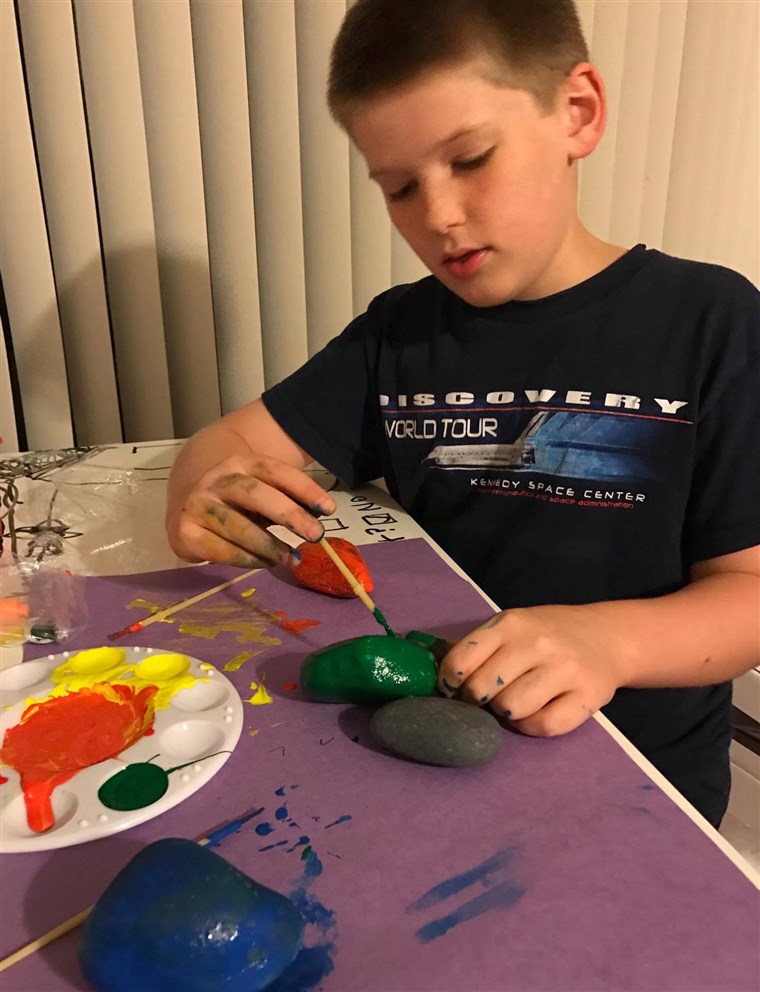 Царрие Cerve, a moderator of the Brevard County, Florida rock group says her son, Elijah, 10, loves to paint, hide and find rocks.