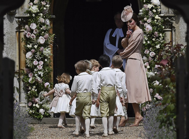 Hertiginna of Cambridge gestures as she walks with the bridesmaids and pageboys as they arrive for her sister Pippa Middleton's wedding to James Matthews, at St Mark's Church in Englefield, England, Saturday, May 20, 2023.