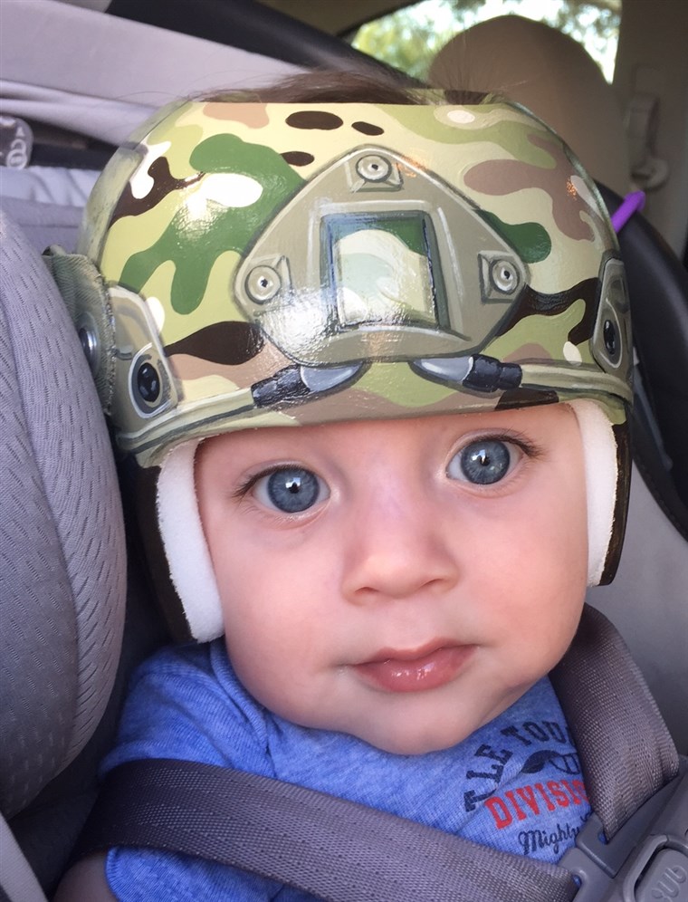 As a nod to her husband's service in the army, Lindsey Menard asked Strawn to paint her son, Levi's, helmet with camouflage.