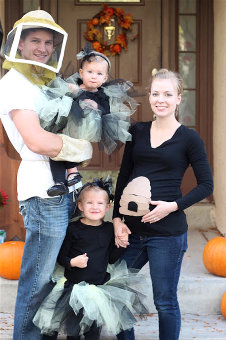 DIY family costume: Beekeeper, two adorable bumblebees, and a beehive.
