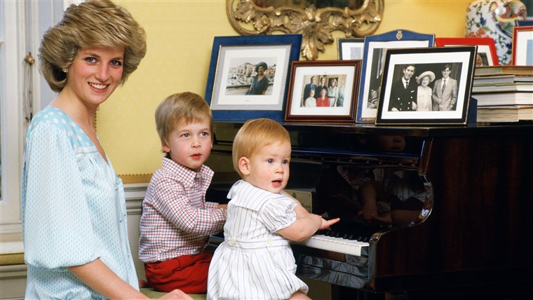 Diana Princess of Wales with her sons, Prince William and Prince Harry, at the piano in Kensington Palace in 1985.