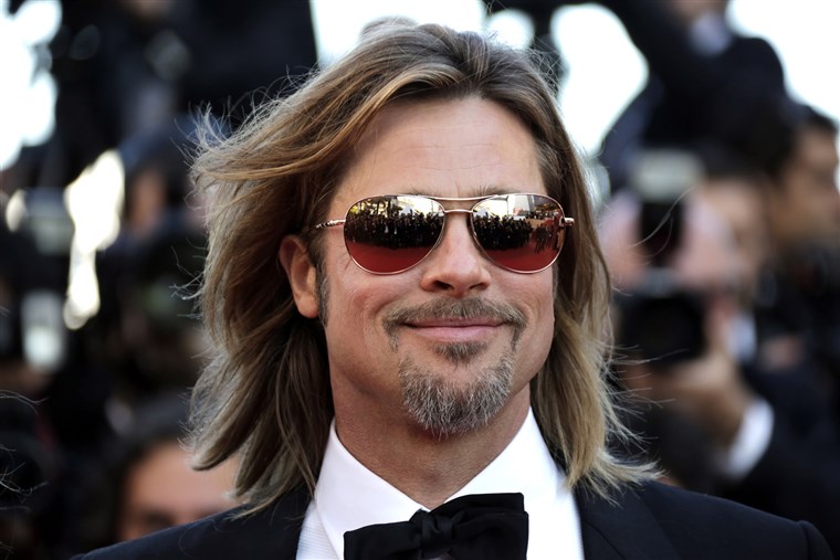 Kasta member Brad Pitt poses on the red carpet ahead of the screening of the film 