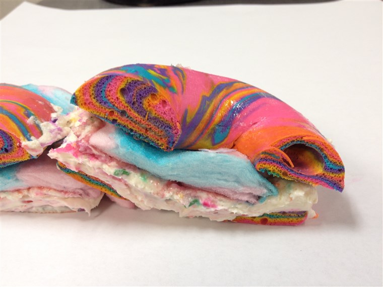 Traversa Section of Rainbow Bagel Stuffed with Funfetti Cream Cheese and Cotton Candy from Brooklyn's The Bagel Store