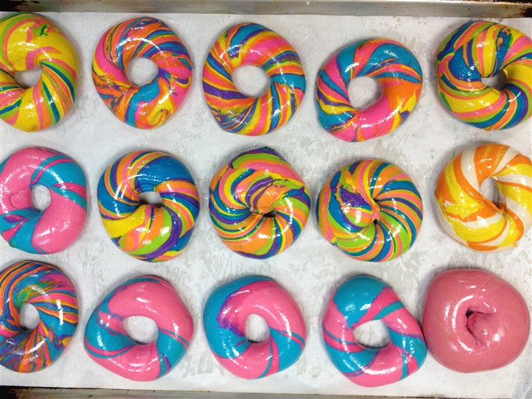 varietate of Rainbow and Psychadelic Rainbow Bagels from Brooklyn's The Bagel Store
